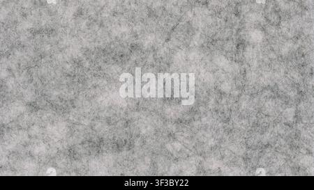 light grey felt non woven fabric texture useful as a background Stock Photo