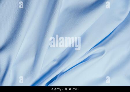 Wrinkled light blue cotton fabric texture background close up Stock Photo