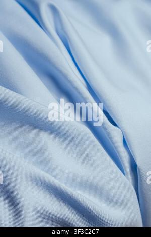 Light blue cotton fabric folds close up abstract textile background Stock Photo