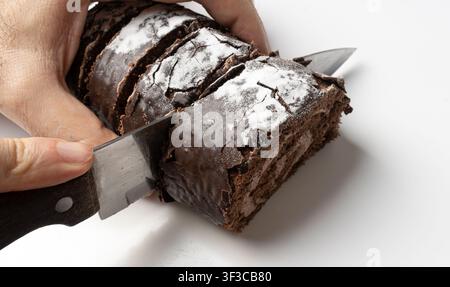 Chocolate Swiss Roll Cutting, Round Sponge Cake Isolated, Sliced Rolled Vanilla Biscuit with Cocoa Cream Filling, Swiss Dessert, Log Cake on White Bac Stock Photo