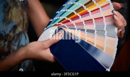 Color palette guide in female hands, color chart choosing Stock Photo