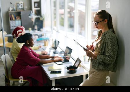 Diverse Women Working in Modern Office during Team Collaboration Stock Photo