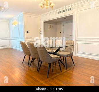 Empty luxury modern dining room with glass table and leather chairs Stock Photo