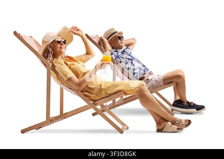 Mature couple relaxing on deck chairs isolated on white background Stock Photo