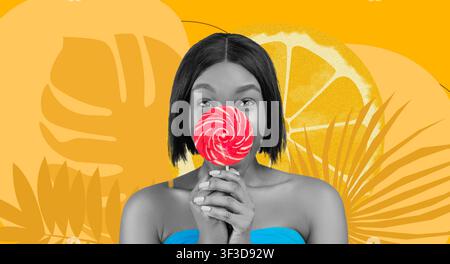 Happy Black Woman Holding Lollipop Smiling Against Bright Yellow Background Stock Photo