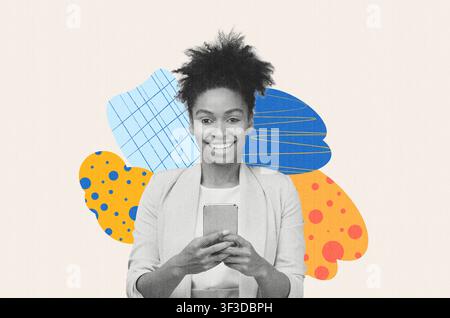 Smiling Black Woman Using Smartphone While Standing In Office, Business Concept Stock Photo