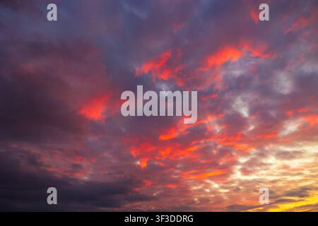 Partly cloudy sunset sky. Dramatic orange sky background photo Stock Photo