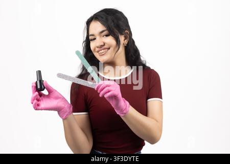 Hairdresser holding professional scissors and cosmetic hair spray bottle Stock Photo