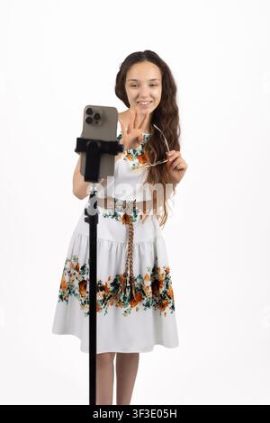 Young talented female singing passionately into retro microphone mic Stock Photo