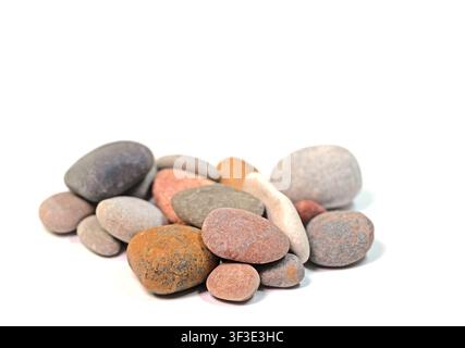 Colorful pebbles against a white background Stock Photo