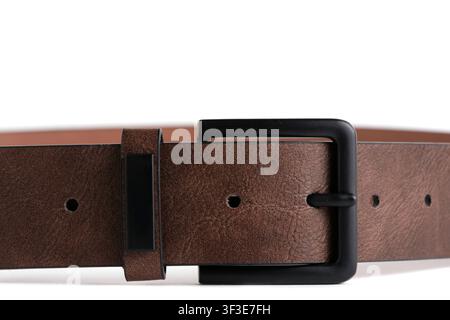 Macro close up view brown leather belt with black matte buckle on white background Stock Photo