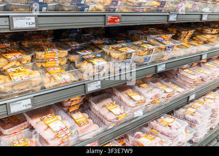 Shelves in a grocery store with prepackaged meat and poultry products. London, UK, 3 March 2024 Stock Photo