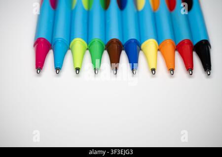 Colorful pens and markers arranged as creative stationery, representing education, writing, drawing, organization and artistic expression Stock Photo