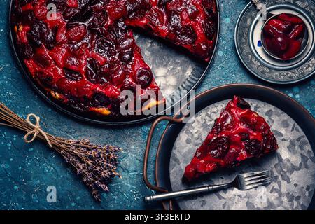 Freshly baked homemade cherry pie slice served on rustic metal tray Stock Photo