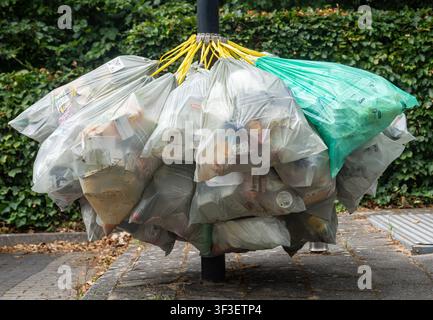 Ede, The Netherlands, 23.06.2026, Municipal plastic trash collection point with bags full of plastic garbage waiting to be collected Stock Photo
