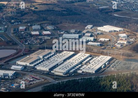 Aerial view of Amazon Web Services' Fadeley Campus data centers and an adjacent electrical substation near Arcola Boulevard surrounded by warehouses Stock Photo