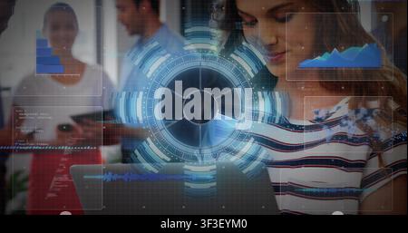 Woman using tablet, driving rotating data HUD, chart updating, code alert flashing red for review Stock Photo