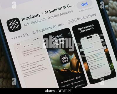 Perplexity AI app listing on an Apple iPhone, illustrating risks of users trusting chatbot answers without understanding AI limits or accuracy. Stock Photo