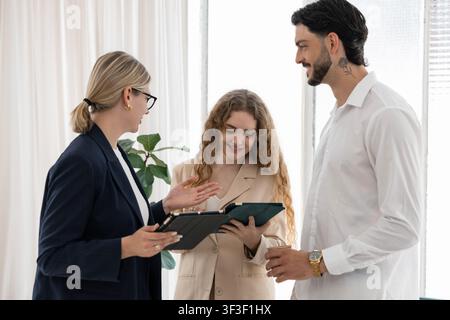 Business professionals discussing project using digital tablets Stock Photo