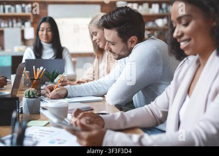 Working process of young multiracial business team Stock Photo