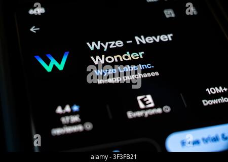 Wyze Smart Home Security App by Wyze Labs Inc. Displayed on Smartphone Screen in Google Play Store Listing Stock Photo