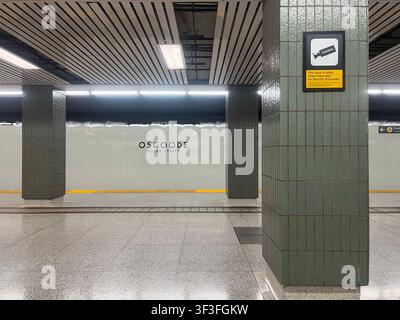 Toronto, Ontario, Canada - July 17, 2026: Empty Osgoode station platform featuring green tiled columns and security camera sign on wall. Stock Photo