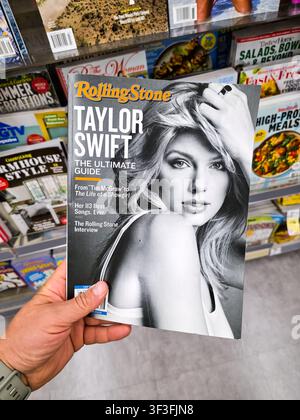 DALLAS, TX, USA - JULY 19, 2026: A detailed close-up of a hand holding a Rolling Stone magazine featuring Taylor Swift on the cover, titled 'The Ultim Stock Photo