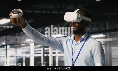 Data center admin using VR headset to monitor neural network AI systems. Server room employee using virtual reality tech to oversee equipment powering machine learning processes Stock Photo