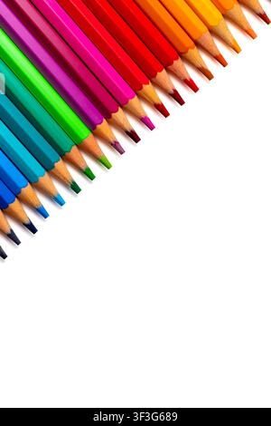 Diagonal row of colorful wooden pencils arranged in a rainbow spectrum on a white background with copy space. Art, education, creativity, design, stat Stock Photo