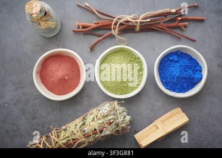 Colorful powders and herbs on a table for creative use Stock Photo