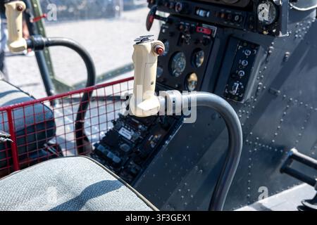 Pilot seat and flight controls of a vintage military aircraft on display Stock Photo
