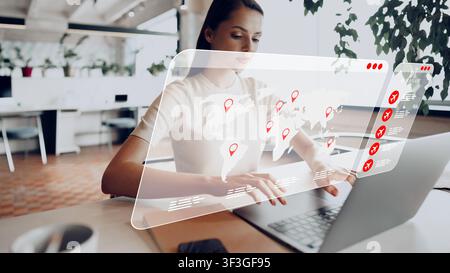 Travel booking process using laptop with world map display showing various locations Stock Photo