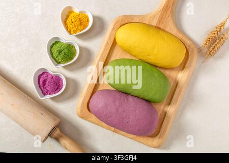 Colorful raw yeast dough flavored with natural vegetable powders Stock Photo