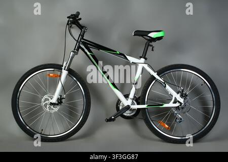 Mountain bike on grey background. Sport bicycle for outdoor activity and recreation. Stock Photo