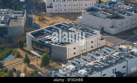 Aerial view of an AI data center, showing cloud computing, GPU infrastructure, high power demand and massive scale digital technology facilities. Stock Photo