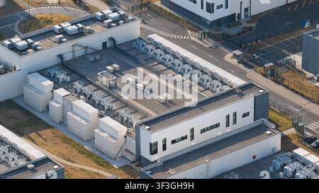 Aerial view of an AI data center, showing cloud computing, GPU infrastructure, high power demand and massive scale digital technology facilities. Stock Photo