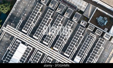 Aerial view of HVAC cooling systems on the rooftop of a data center, showing large scale computing infrastructure, server facility equipment and cloud Stock Photo