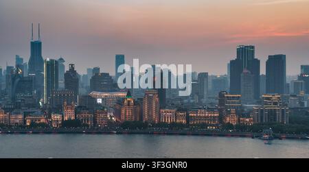 Shanghai, China - May 4, 2026: Scenic sunset view of the historic Bund architecture and modern skyscraper skyline along the Huangpu River in Shanghai Stock Photo