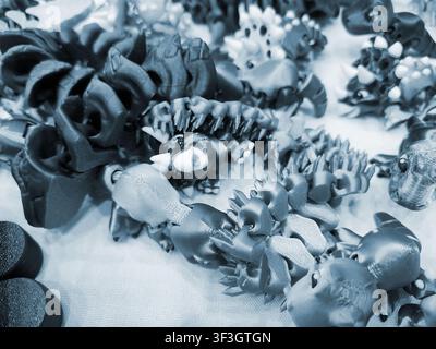 Art models printed on 3D printer. Different objects created on 3D printer from molten plastic. 3D printed different objects. Modern new modern additive progressive technologies. 3D printing technology Stock Photo