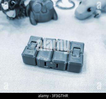 Art models printed on 3D printer. Different objects created on 3D printer from molten plastic. 3D printed different objects. Modern new modern additive progressive technologies. 3D printing technology Stock Photo