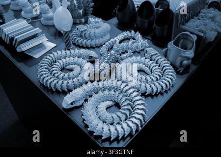 Art models printed on 3D printer. Different objects created on 3D printer from molten plastic. 3D printed different objects. Modern new modern additive progressive technologies. 3D printing technology Stock Photo