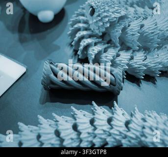 Art models printed on 3D printer. Different objects created on 3D printer from molten plastic. 3D printed different objects. Modern new modern additive progressive technologies. 3D printing technology Stock Photo