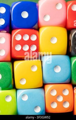 Educational and mathematical concept showing multiple random numbers on colorful dice Stock Photo