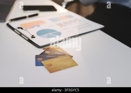 Young Asian business woman using smartphone and credit card for online shopping. Online Payment. Stock Photo