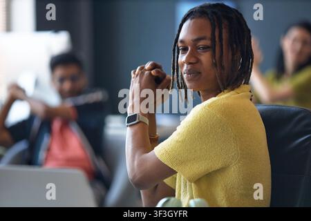 Black Man Collaborating in Creative Office Team Meeting Stock Photo