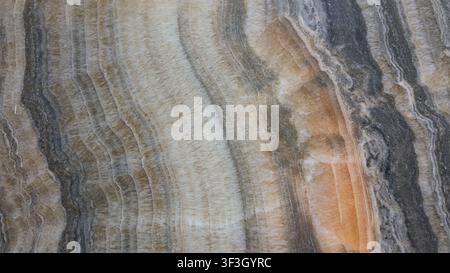 Brown marble surface with natural stone texture, featuring elegant patterns and rich earthy tones. Stock Photo