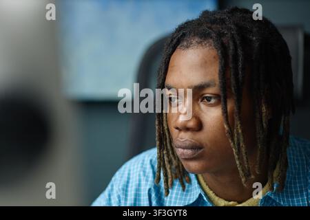 Black Man Working at Computer in Office for Business Technology Stock Photo