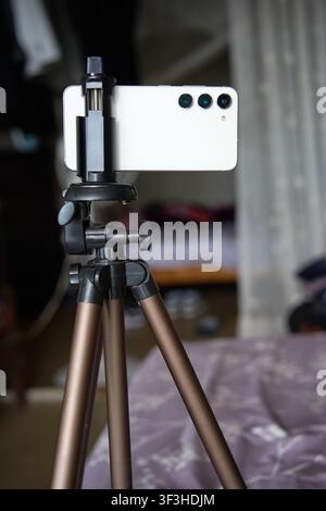 smartphone mounted on a mobile tripod Stock Photo