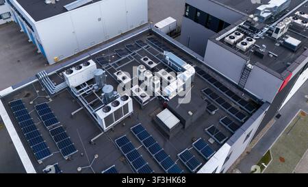 Aerial view of Data Center Rooftop with HVAC Cooling Units and Solar Panels for Cloud Computing and Sustainability Stock Photo