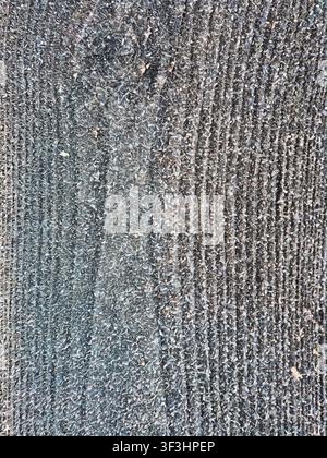 This image features a detailed, closeup view of a rough, textured surface composed of gray and white fibers with a distinct vertical pattern Stock Photo